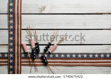 American stars and stripes flat lay over rustic wood background 
