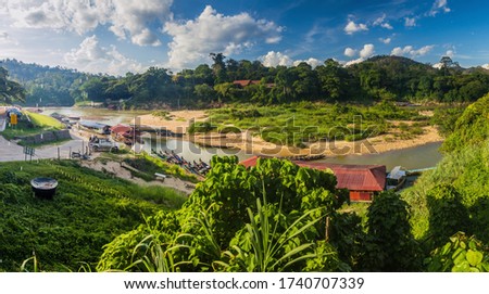 View of Tembeling river in Kuala Tahan village, Taman Negara national park, Malaysia Royalty-Free Stock Photo #1740707339