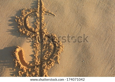 dollar sign on the beach