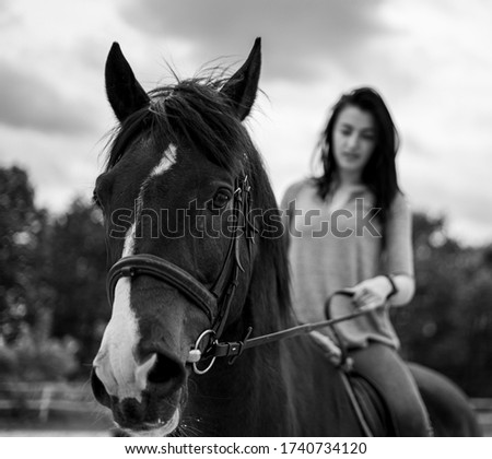 black and white horseriding picture