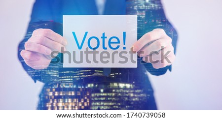 Double exposure of businesswoman in suit holding blank paper for text. 