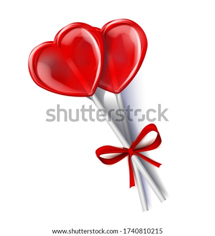 two red lollipops candy sweet isolated on white background. tied with a red ribbon on a bow. Layout for Valentine's Day