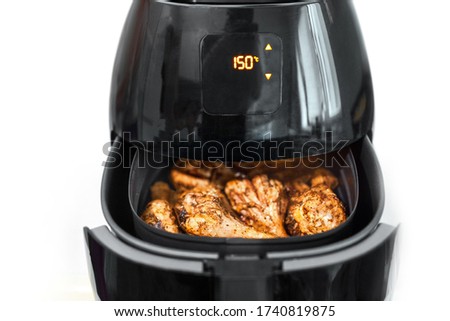 Air fryer, healthy cooking without oil, kitchen fryer on white background Royalty-Free Stock Photo #1740819875