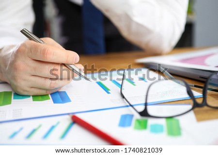 Businessman considers financial report corrections. Indicators in context existing advertising campaigns. Data from different sources on one screen. Setting specific goals and objectives Royalty-Free Stock Photo #1740821039