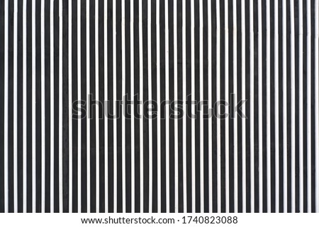 Background of a wall of smooth metal stripes