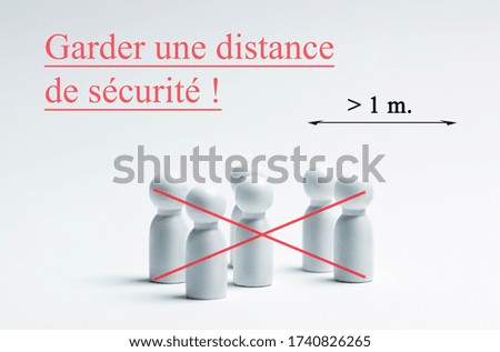 Social distancing concept with french writing, translation - keep safe distance. Preventing the spread of the virus.