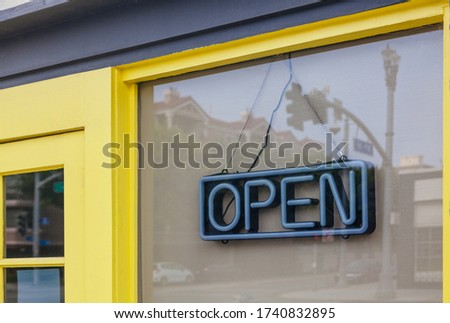 Closed Business with Neon Open Sign Hang on the Window