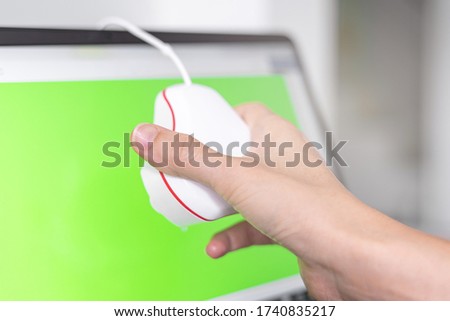 Women hand use calibrate tool check color of monitor on computer laptop monitor inspection concept before Image work 