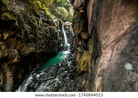 Slow shutter speed photograph waterfall and water. Slow motion water photography. Waterfall in autumn forest