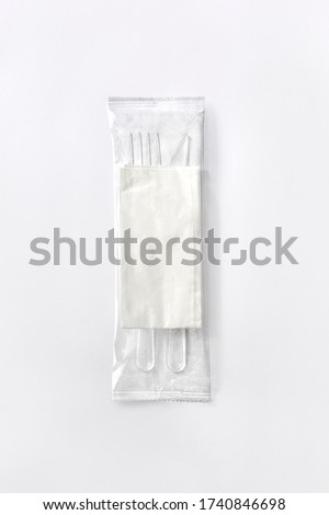 plastic cutlery set with fork knife and napkin Royalty-Free Stock Photo #1740846698