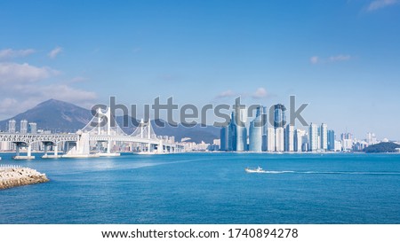 busan city and Gwangan bridge and fisherman's boats, Haeundae, Busan,Korea. Royalty-Free Stock Photo #1740894278