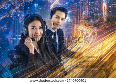 Double exposure effect. Young beautiful female customer support operator with headset isolated on city skyline skyscraper view background.  Business and Communication Concept
