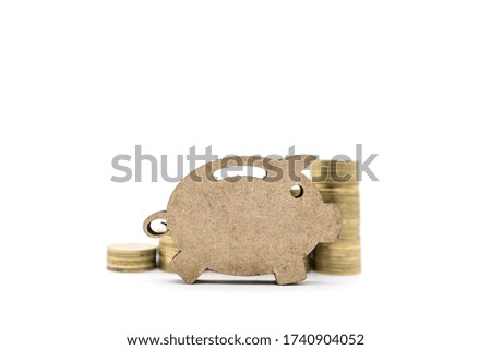 Business, Money, Finance, Security and Saving Concept. Closeup of wooden piggy bank icon with stack of coins on white background and copy space.