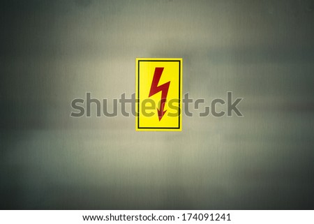 sign of danger high voltage symbol on the metal wall