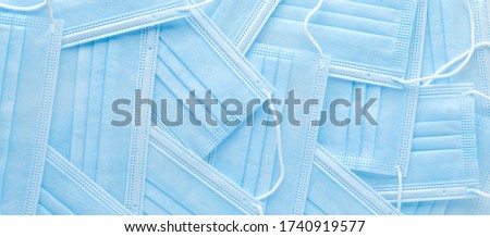 Pile of disposable personal protective equipment, PPE, medical face masks. Royalty-Free Stock Photo #1740919577