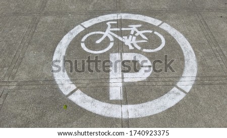 Parking sign dedicated for bicycle and cyclist on the pavement