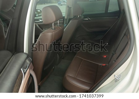 Luxury car inside. Interior of prestige modern car. Comfortable leather seats. 