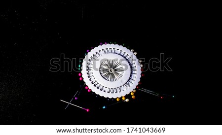 Color Sewing Needles or  Equipment for Seamstresses Different Types. isolated on a black background.