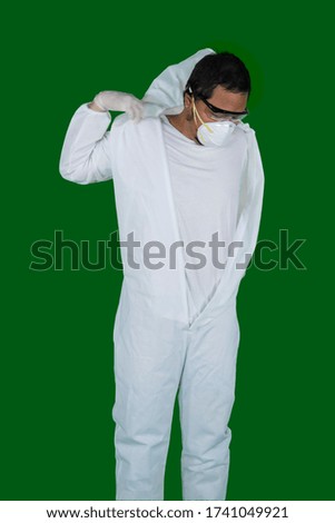 Doctor wearing protective suit in the studio to protection from coronavirus
