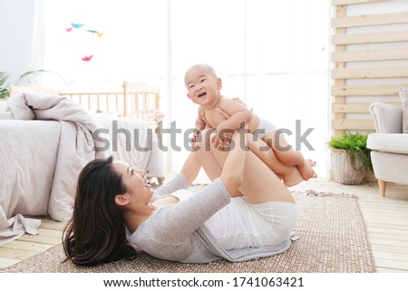 Happy mother and son play