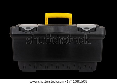 black plastic tool box isolated on black background close up