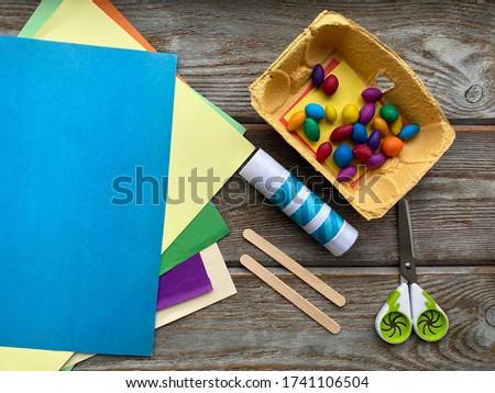 Children's creative kit, colored paper, scissors and plasticine, ready for DIY.