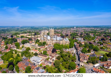 Aerial photo of the city centre of Lincoln and Lincoln Cathedral, Lincoln Minster in the city centre of Lincoln on a bright sunny summers day showing the historic Cathedral Church in the city centre