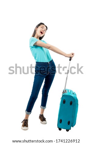 Asian woman standing with suitcase isolated over white background