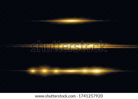 Glowing streaks on dark background. Luminous abstract sparkling lined background. Yellow horizontal lens flares pack. Laser beams, horizontal light rays. Beautiful light flares. 