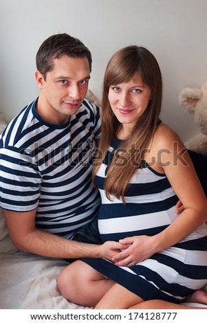 Couple, family portrait, pregnant woman