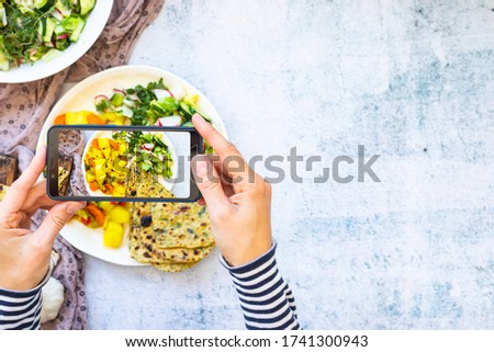 Phone photography of vegan food. Make picture of chapati and sabji.