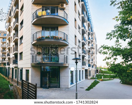 Modern residential apartment and flat building exterior. Part of New luxury house and home complex. City Real estate property and condo architecture. Copy space. Blue sky