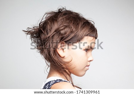 Portrait of a child with a short trendy hairstyle