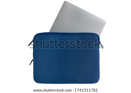 Metallic laptop inserted half-way into blue computer case with open zipper against white background Royalty-Free Stock Photo #1741311782