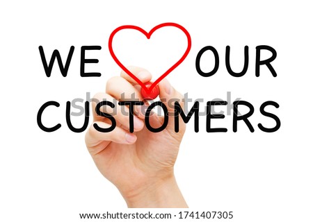 Hand writing We Love Our Customers with marker on transparent wipe board. Customer satisfaction, appreciation and kindness concept. Royalty-Free Stock Photo #1741407305
