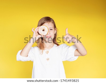 girl holding donuts in her hands. funny face. Good morning