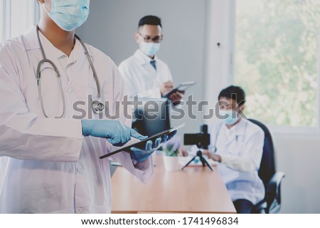 Online medical meeting on the epidemic coronary virus (COVID-19) on the computer and tablet Royalty-Free Stock Photo #1741496834