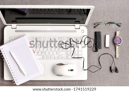 Modern comfort work place. Working desk table concept.Business desktop with white laptop, accessories and work equipment