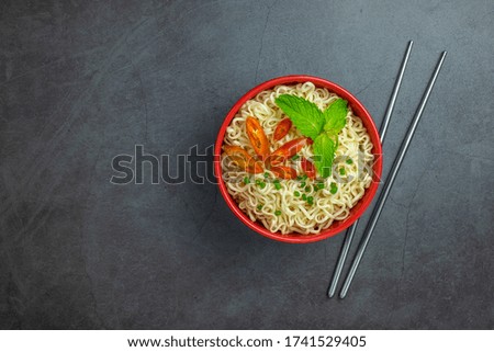 noodles in a bowl on the table top view, with copy space
