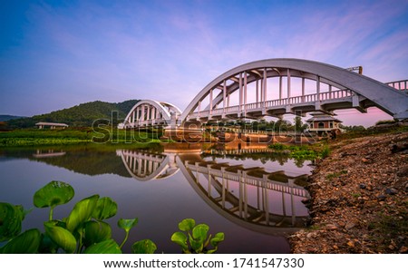 White Bridge or Saphan Tha Chomphu with reflection in twilight at Lamphun, Thailand.