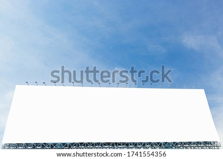 Blank billboard with a background of sky. With clipping path on screen - can be used for trade shows, and advertising or promotional poster for you.