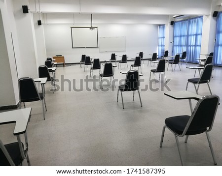 The classroom chairs are 6 feet apart, according to the principle of physical distancing. Royalty-Free Stock Photo #1741587395