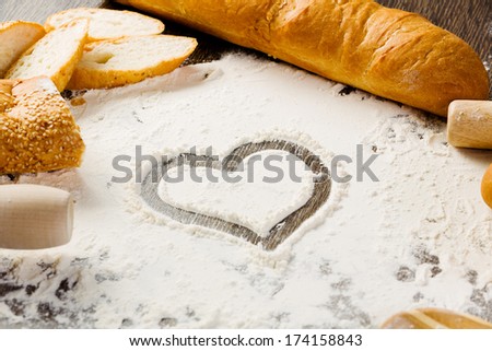 White bread and flour on kitchen table
