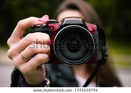 Camera close-up held in hands, training photos, photo Hobbies, walking during isolation, beautiful frames, lens close-up, photo lens