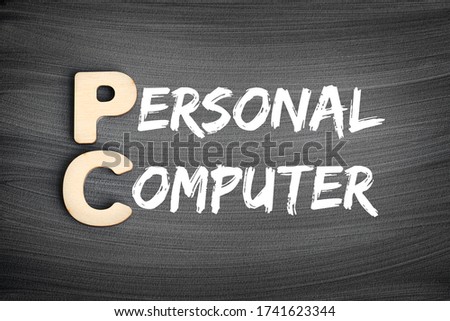 PC - Personal Computer acronym, technology concept on blackboard