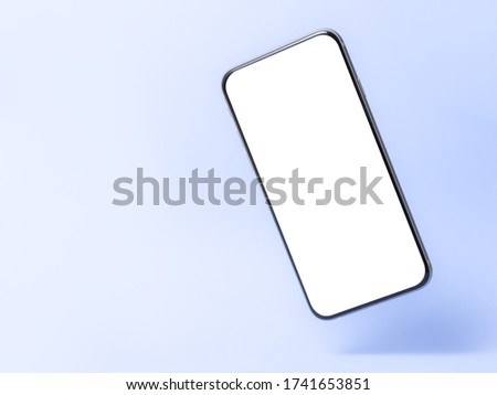 Smartphone mockup, phone with blank screen and shadow isolated on blue background. Symbol of lightness freshness airiness. Modern technologies social networks and applications. Copy space
