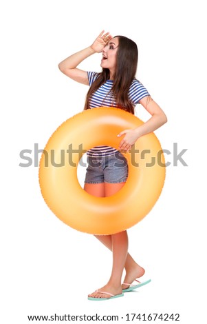Young girl with inflatable ring isolated on white background