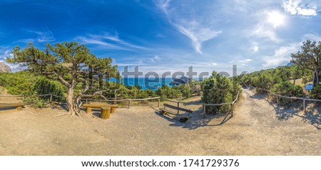 Beautiful seascape, panorama of cape Kapchik to the Galitsin Trail and blue bay of the Black Sea. Sudak, New World. Landscape of the sea coast. The concept of calmness, silence and unity with nature. Royalty-Free Stock Photo #1741729376