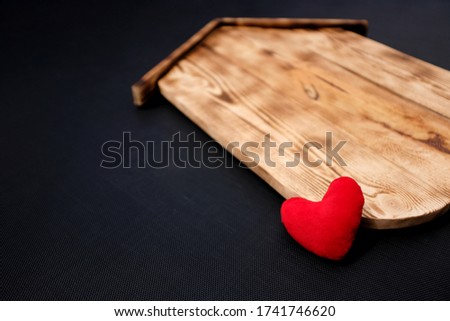 Blank Wood House with heart on black background. Concept sale, construction of ecological houses and discounts.