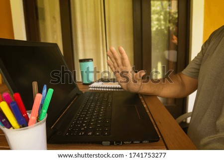 Man doing computer work from home during quarantine. Social isolation of office workers. Pandemic teleworking concept